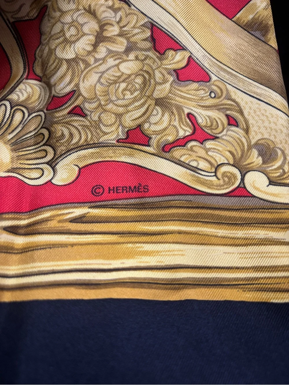 Hermès silk scarf in gold, red and black ornate print